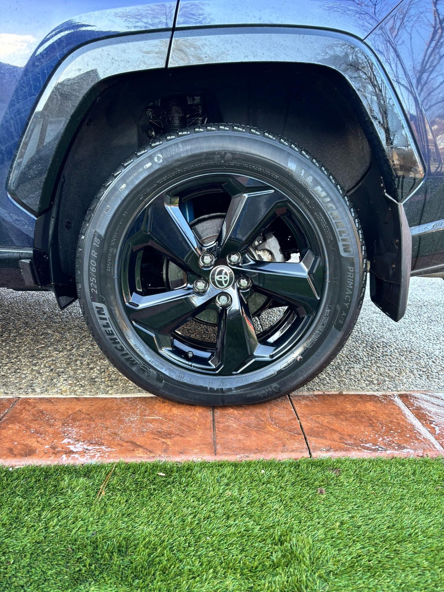 Detailed wheel with glossy finish on a RAV4